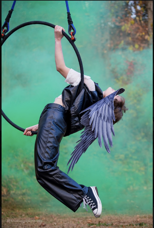 Aerial hoop performer with wings